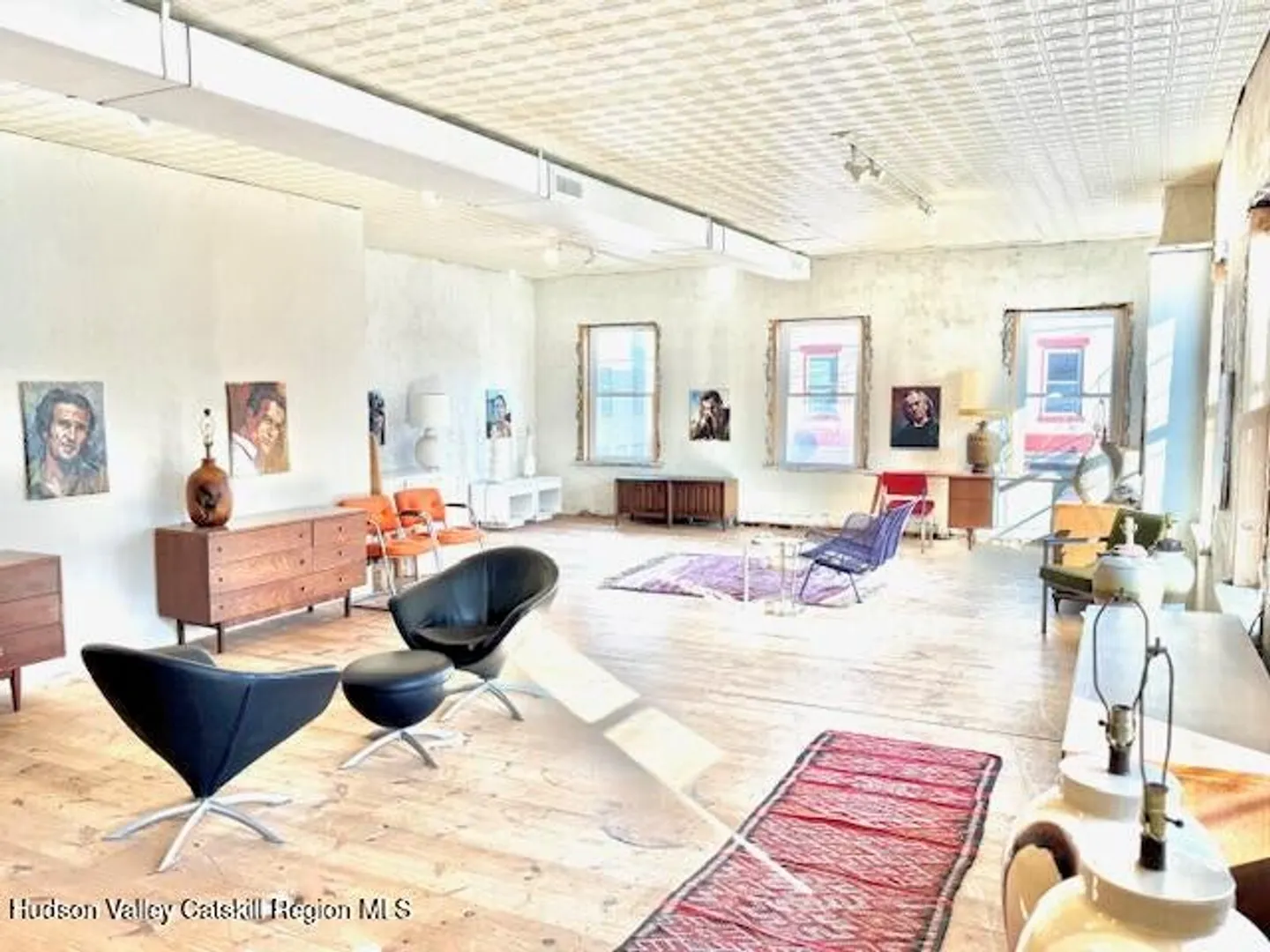 Open gallery interior with large front windows