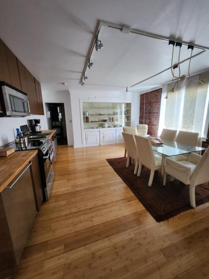Apartment kitchen and dining room viewed toward living area